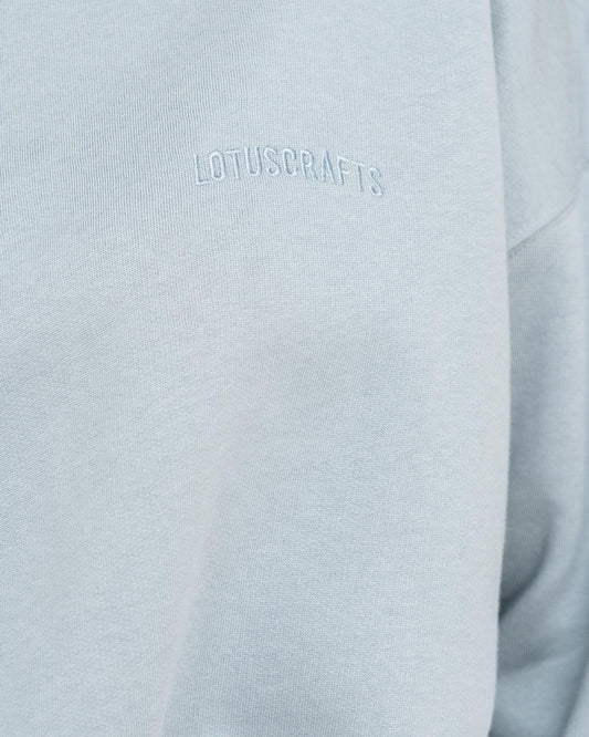 Stone Blue - Model in cropped Yoga Sweater Detail Logo Lotuscrafts